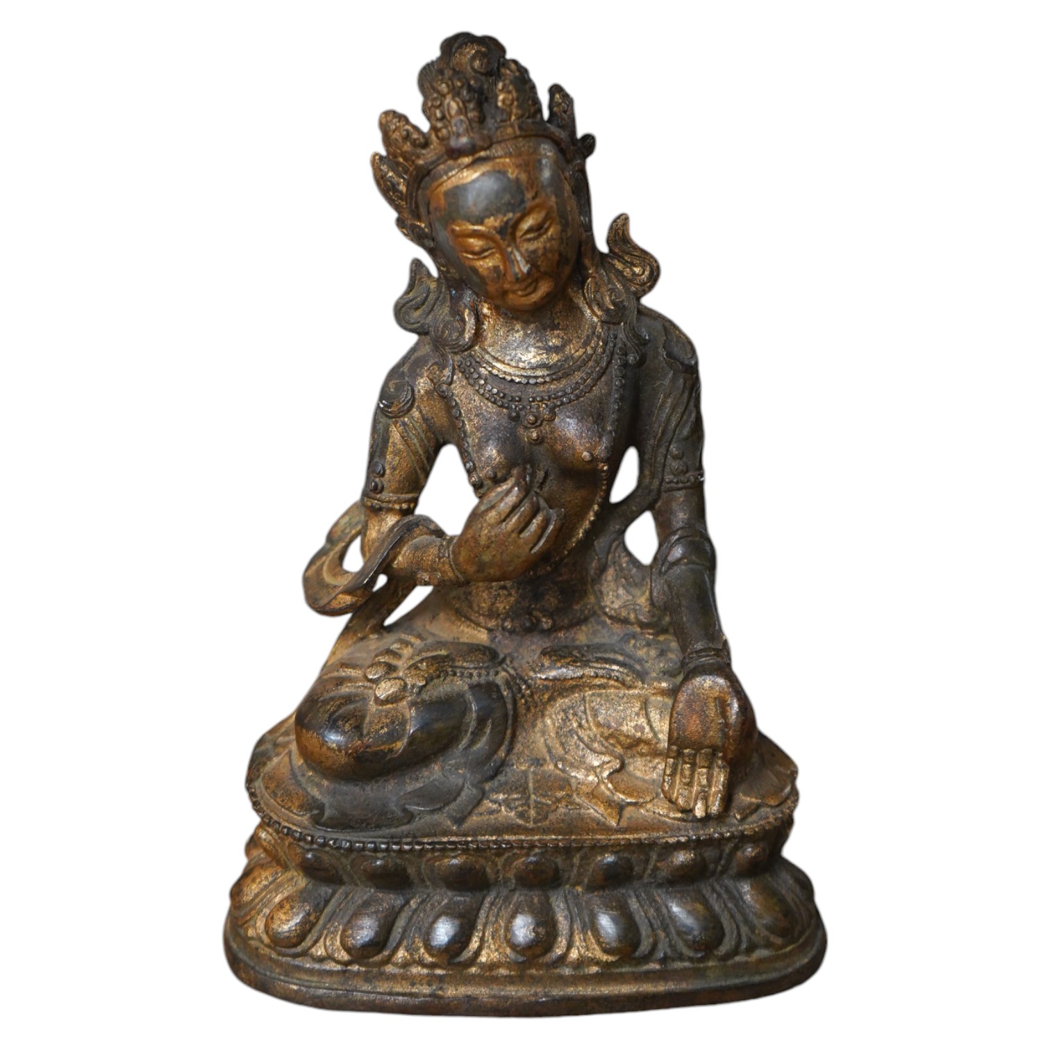 A Tibetan gilt bronze figure of seated Tara, on a double lotus throne, 16.5cm high. Condition - good